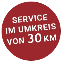 Roter Button mit der Schrift SERVICE IM UMKREIS VON 30 KM